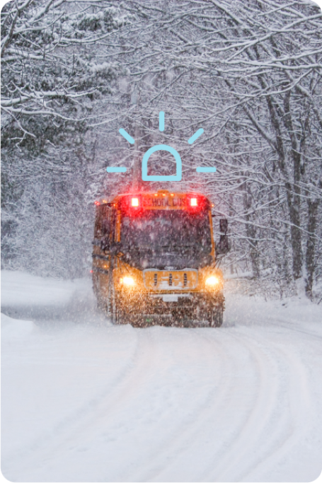 School Bus stuck in snow with an emergency alert graphic.