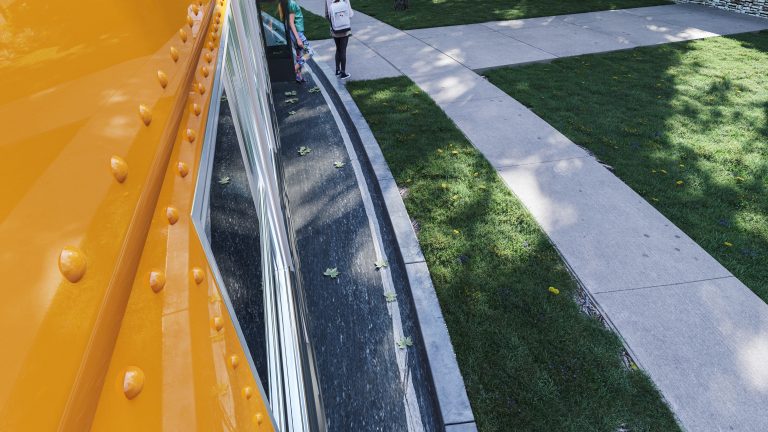 Camera view of students exiting the bus.