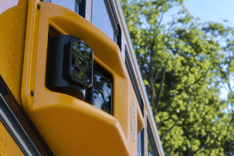 Side view of a school bus security camera.