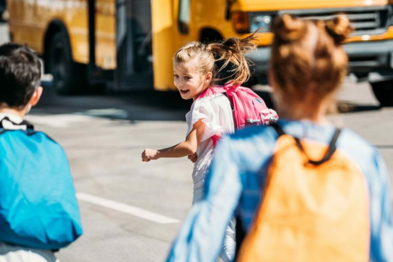 Kids going to the school bus.